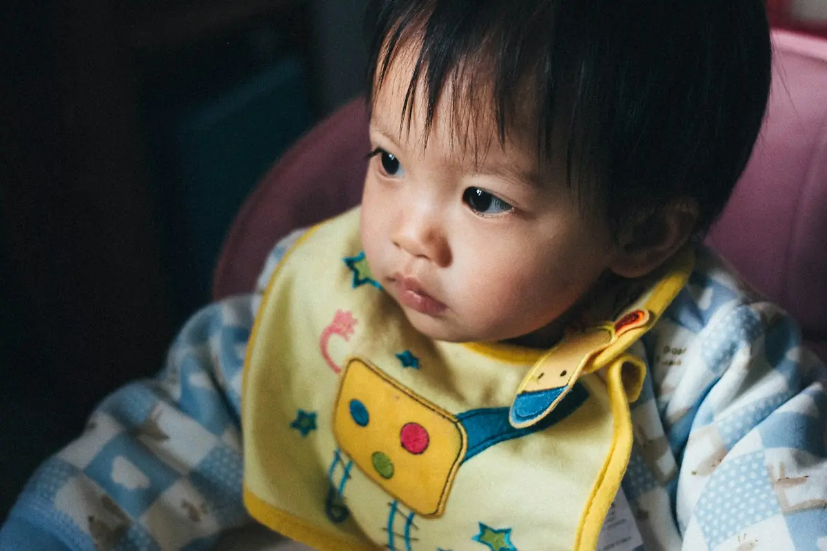 Baby wearing a cotton terry bib